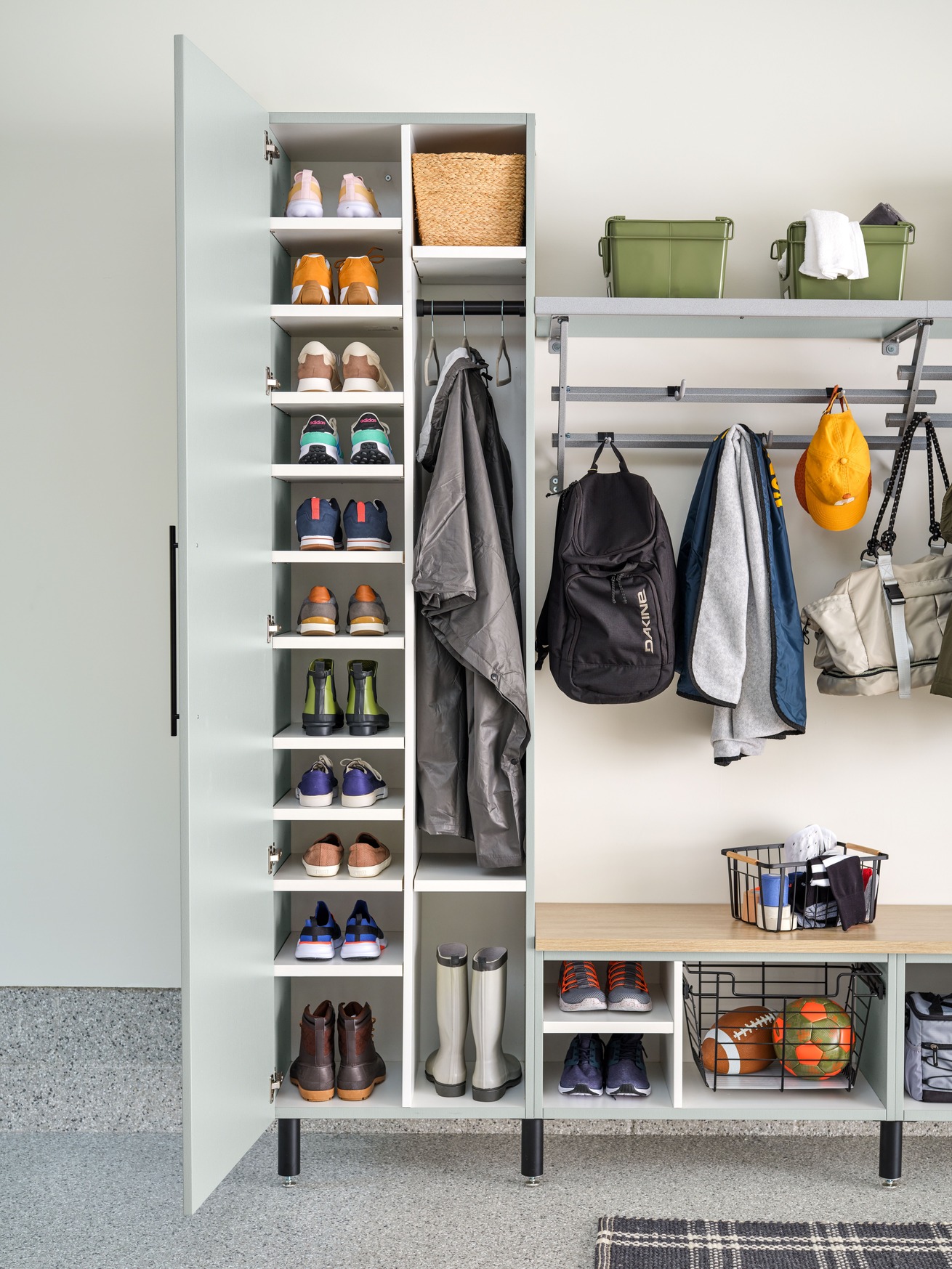 Custom garage cabinets and slatwall organization system installed in a Delaware garage