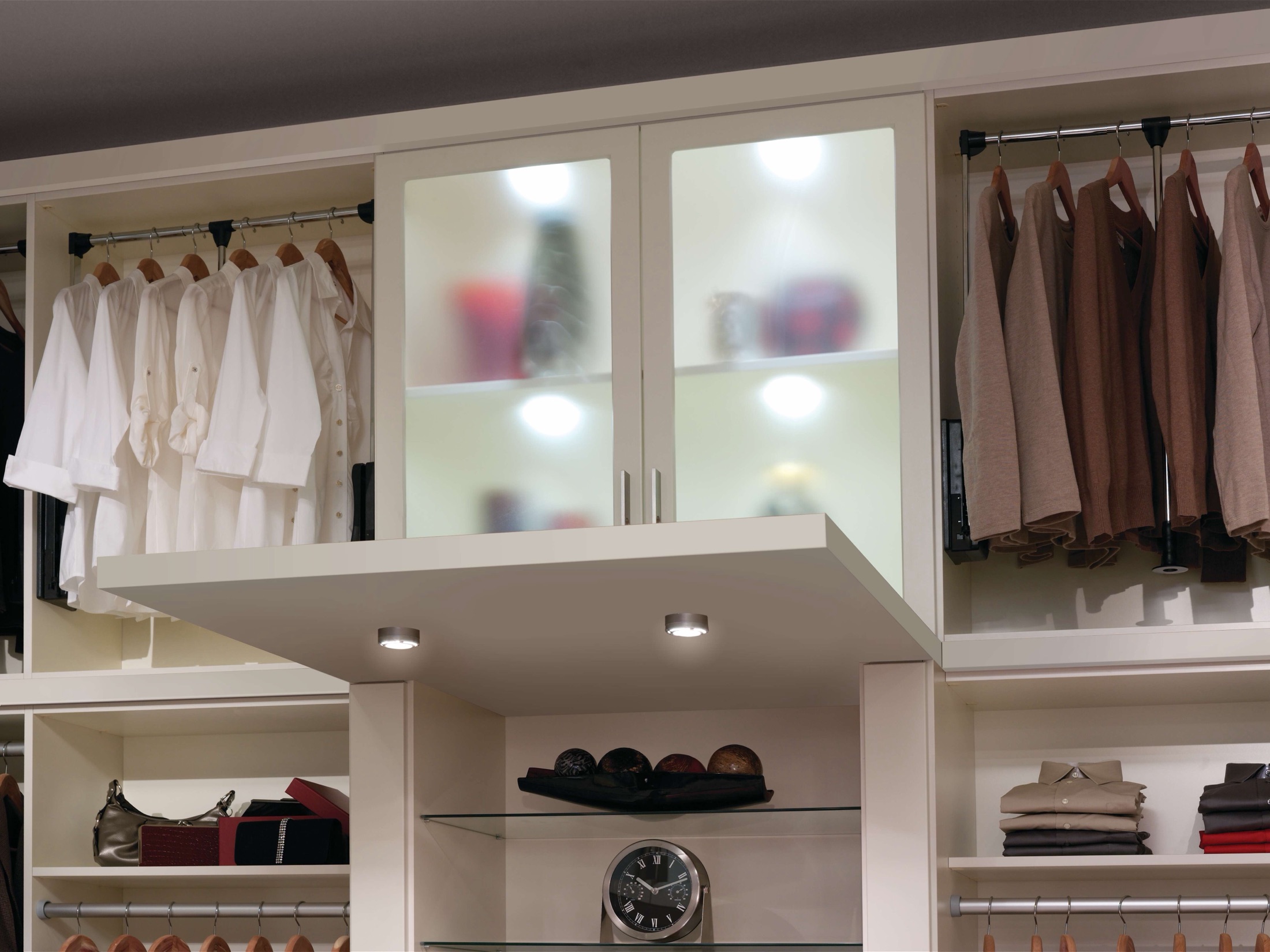 Custom walk-in closet with wood-tone shelving and soft-close drawers in a Delaware home