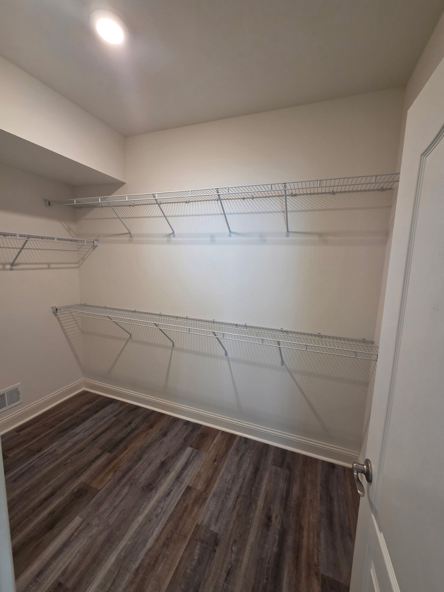 Standard builder closet with wire shelving, before design