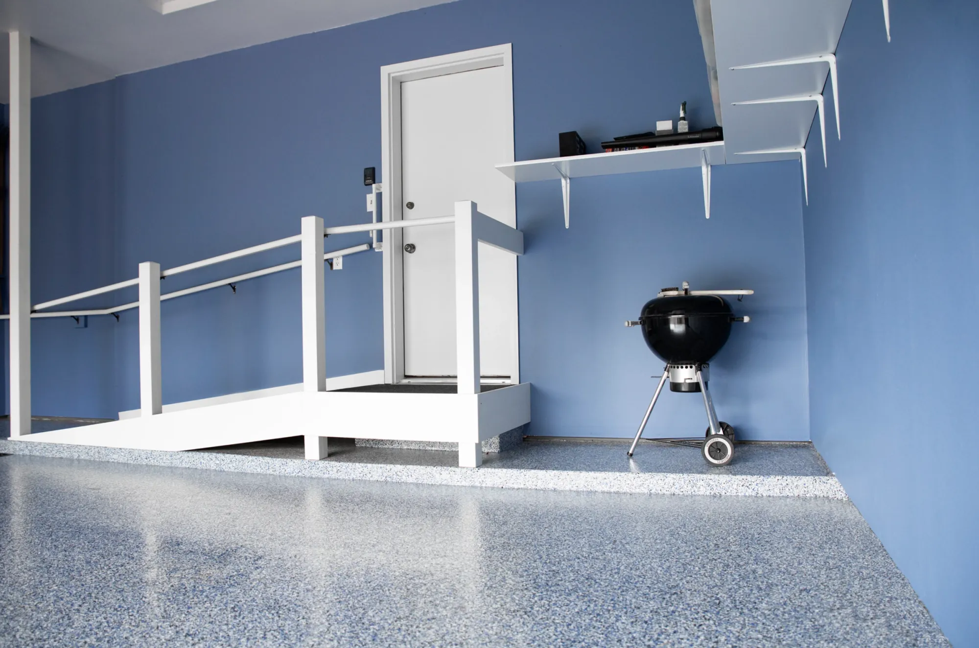 Decorative flake epoxy garage floor coating in a Millville, Delaware home