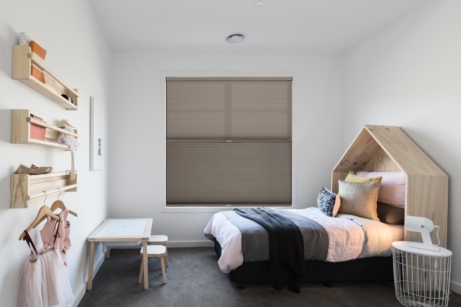Blackout Softlight shade lowered in a calm bedroom for room-darkening
