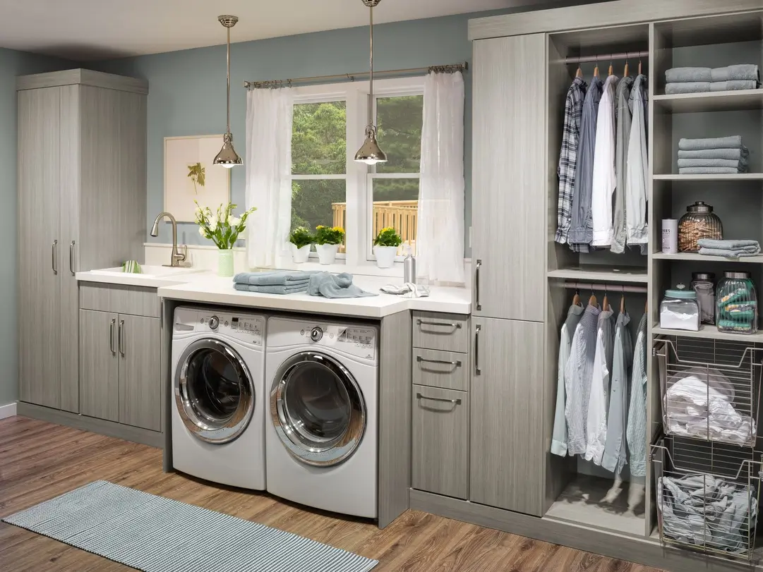 Custom laundry room with folding counter and built-in shelving