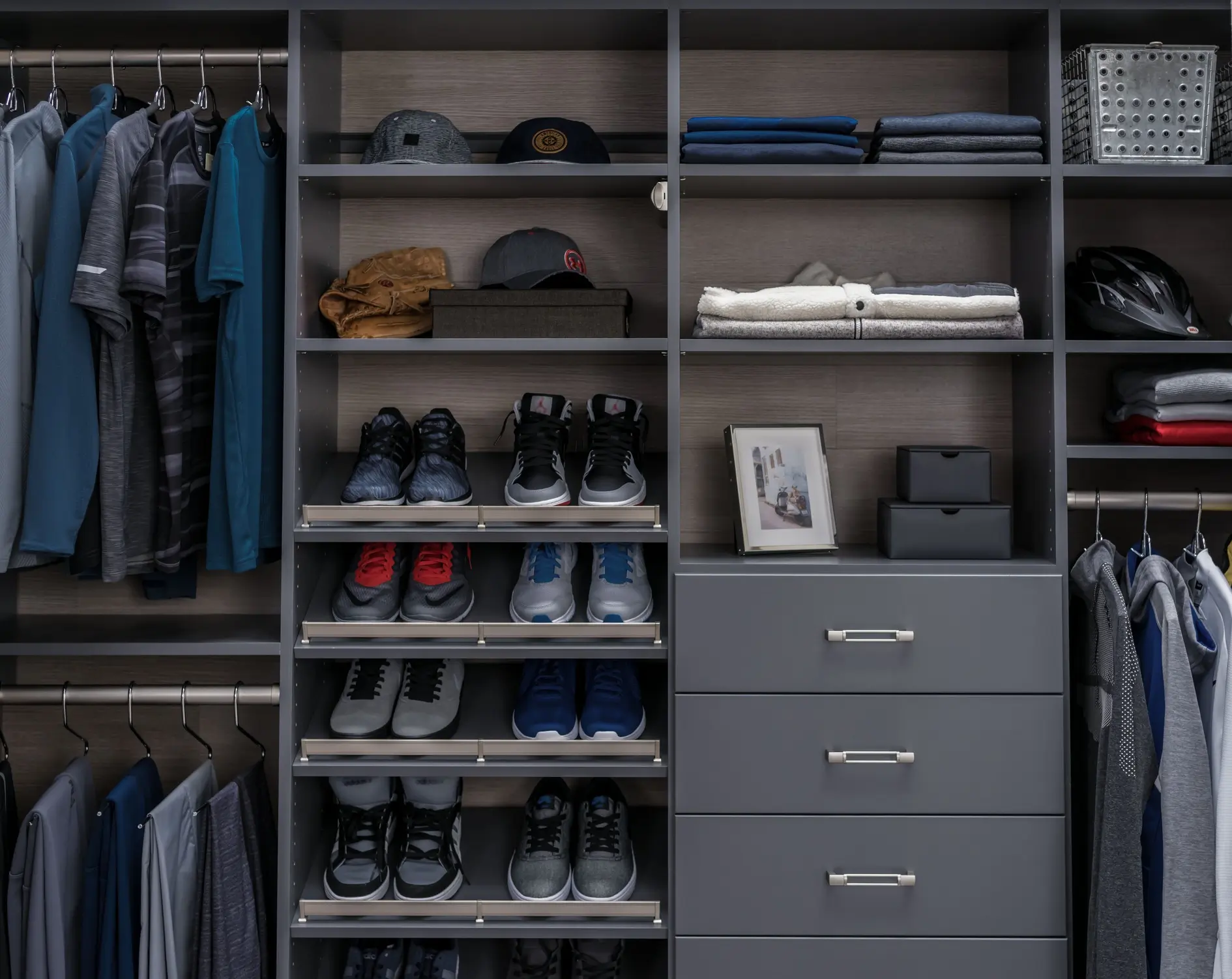 Luxury walk-in closet with built-in shelving and custom finishes